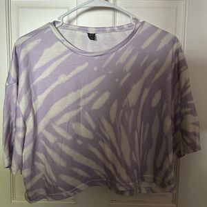Cropped Purple and White design t-shirt.